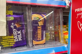 Numerous products are being kept in security boxes at supermarkets - including £2 chocolate bars (Photo: James Linsell Clark/SWNS)